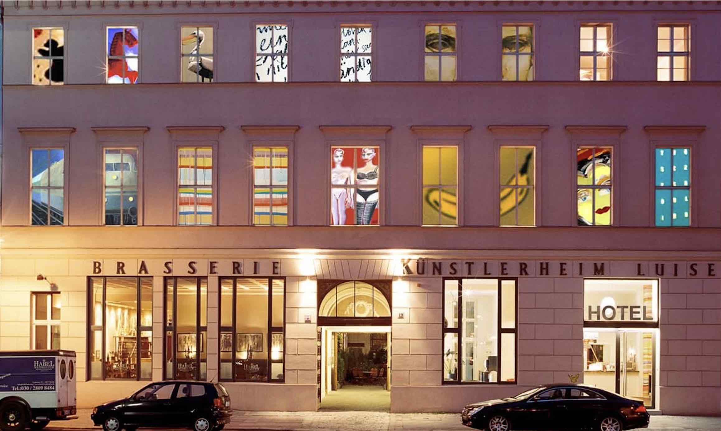 Arte Luise Arthotel unique hotels in berlin exterior at night with painted windows