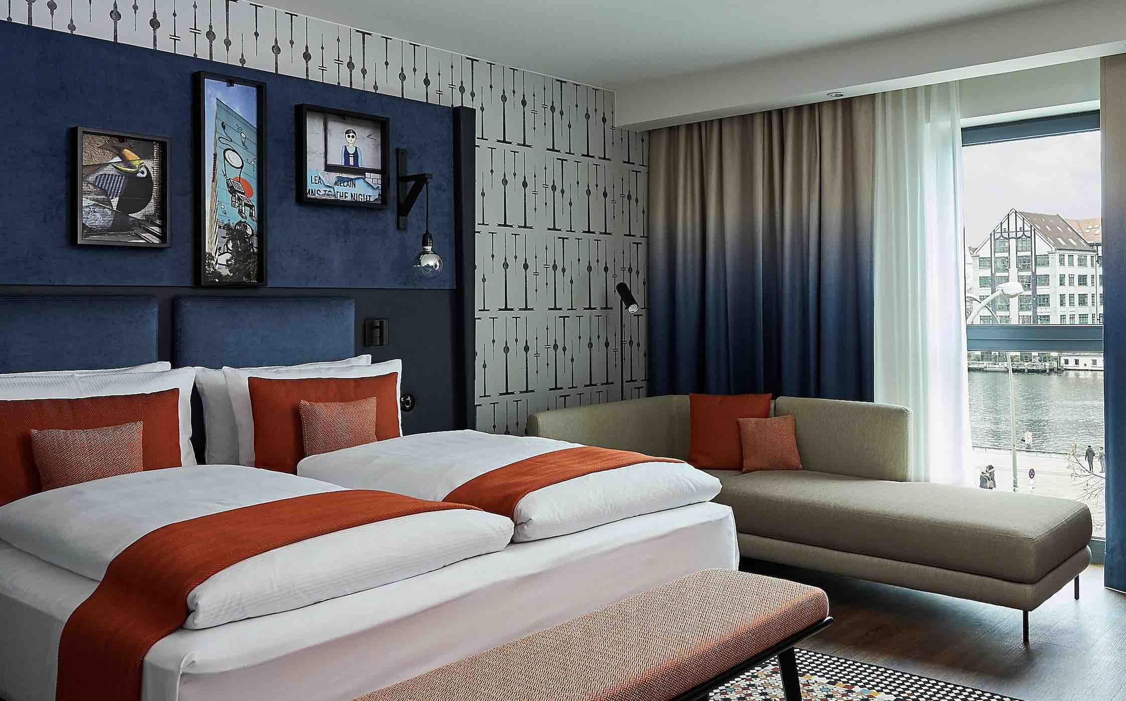 Hotel Indigo East Side Gallery unique hotels in berlin bedroom with view over river