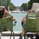 filip-mishevski-self-guided Paris literary tour couple reading books near a fountain -unsplash copy 2