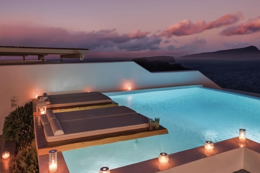 Phōs the Boutique Luxury Hotel & Villas pool at night at one of tge best boutique hotels in Santorini