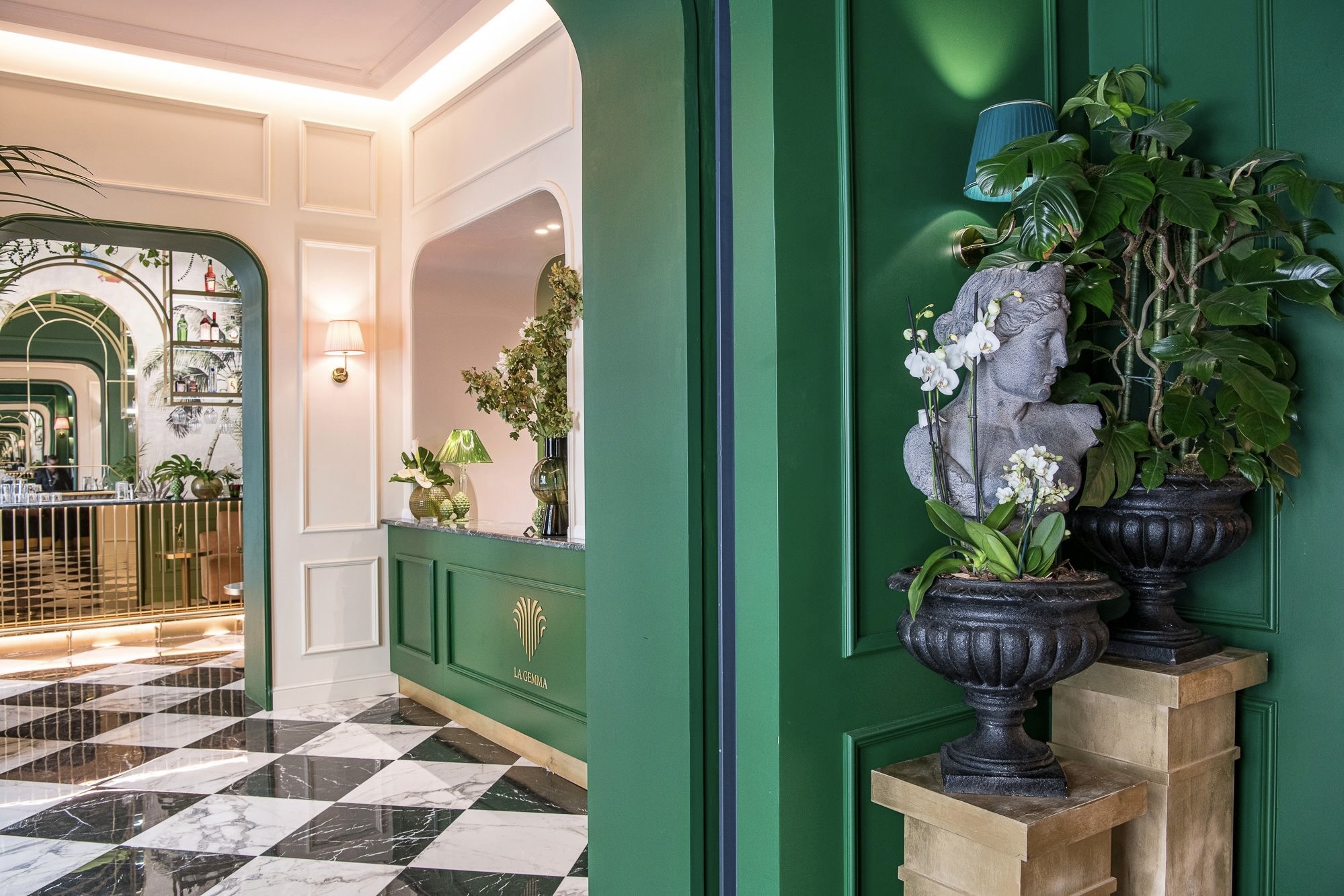 The lobby at Hotel La Gemma with plants