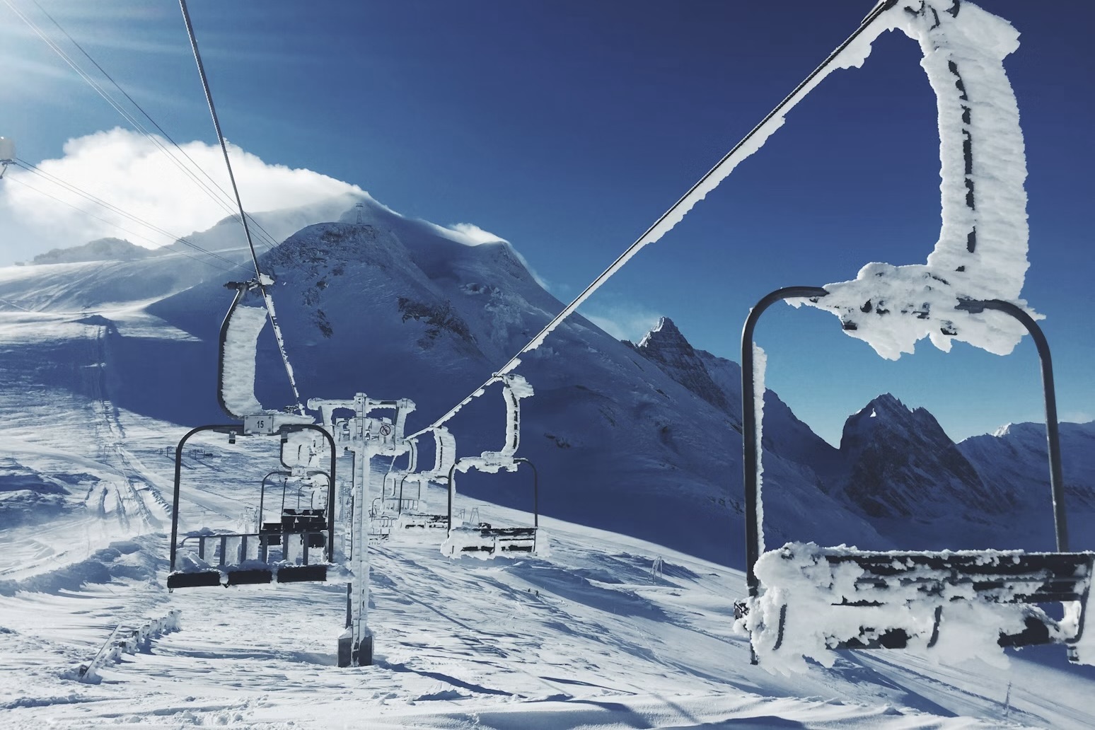 Photo Robert Bye Unsplash in Tignes, France of skilifts covered in ice and snow